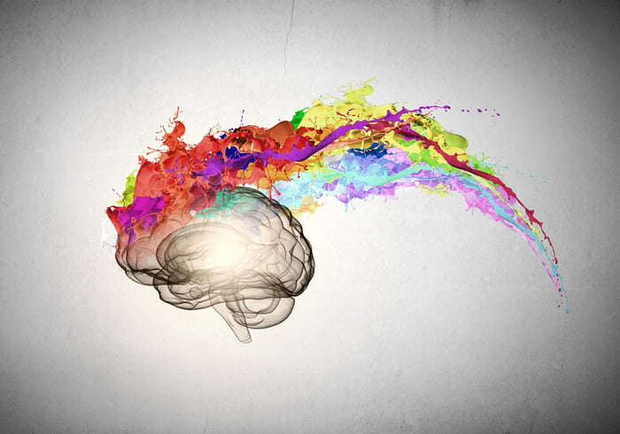 Conceptual image of human brain in colorful splashes