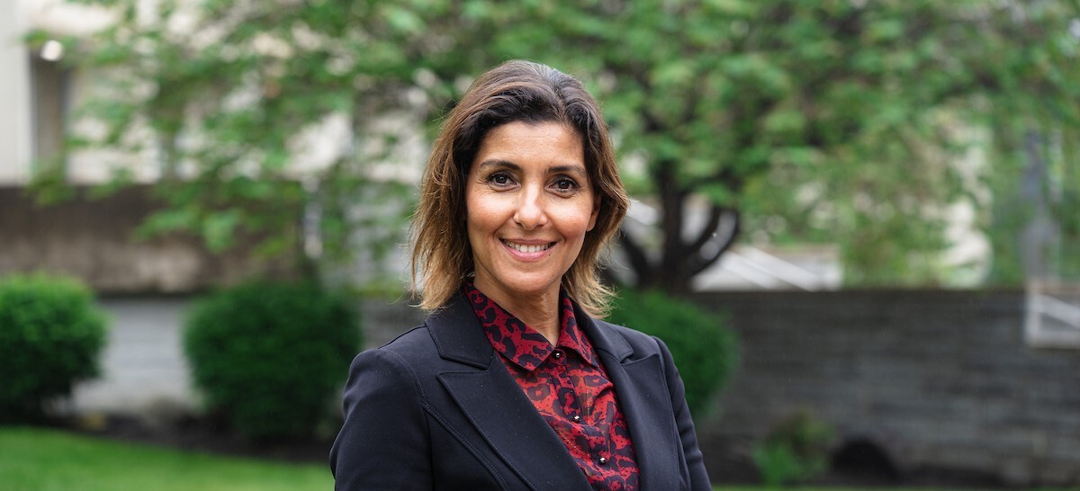 Headshot of Dr. Najiba Benabess, Dean of the NU Business School, in front of greenery Headshot of Dr. Najiba Benabess, Dean of the NU Business School, in front of greenery