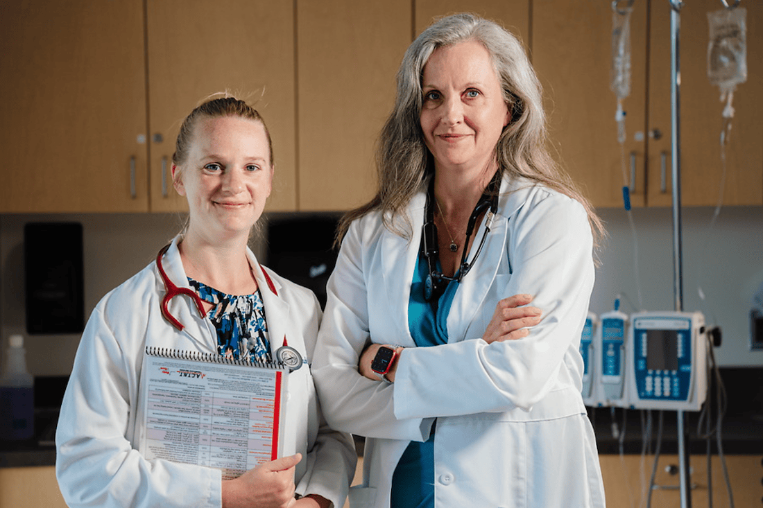 DNP nursing student with professor. 